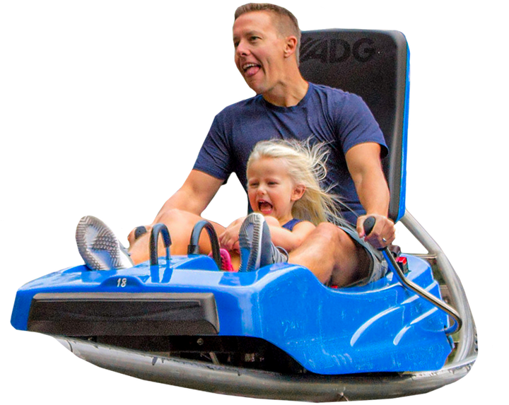 Father and daughter enjoying riding in a Branson coaster