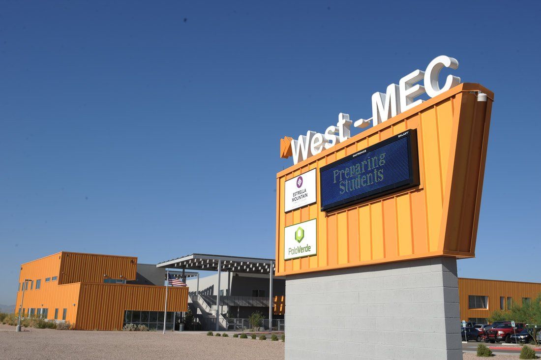 A building with a sign that says west mec on it