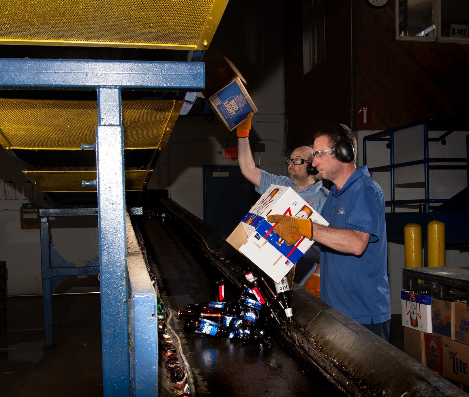 a container filled with crushed cans in a factory .