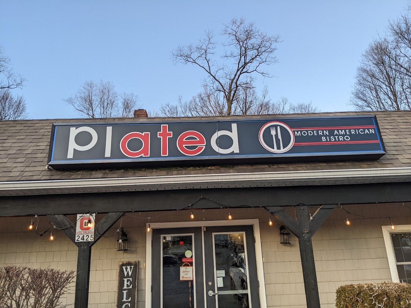 A restaurant with a sign that says plated on it