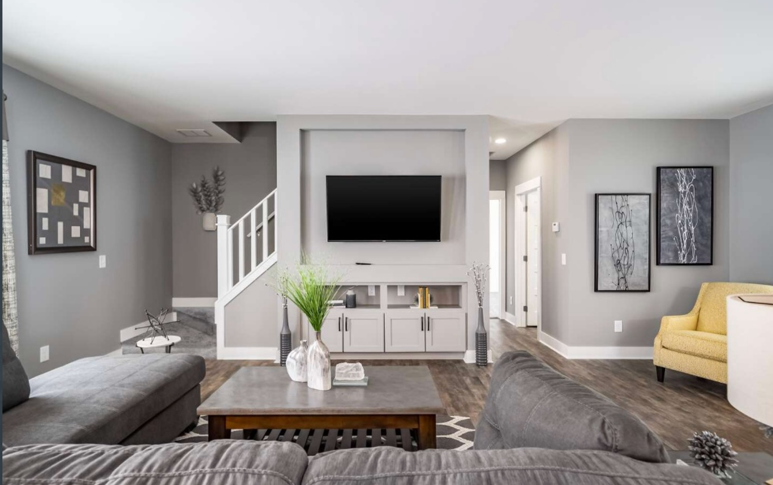 An artist 's impression of a small house with a porch