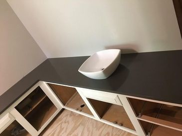 A sink is sitting on top of a counter in a bathroom.