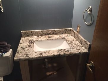 A bathroom with a sink and a toilet.