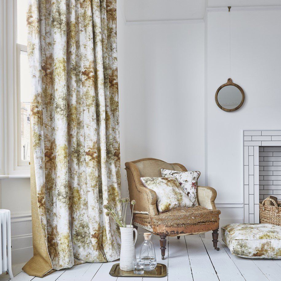 White and gold curtains in rustic white room