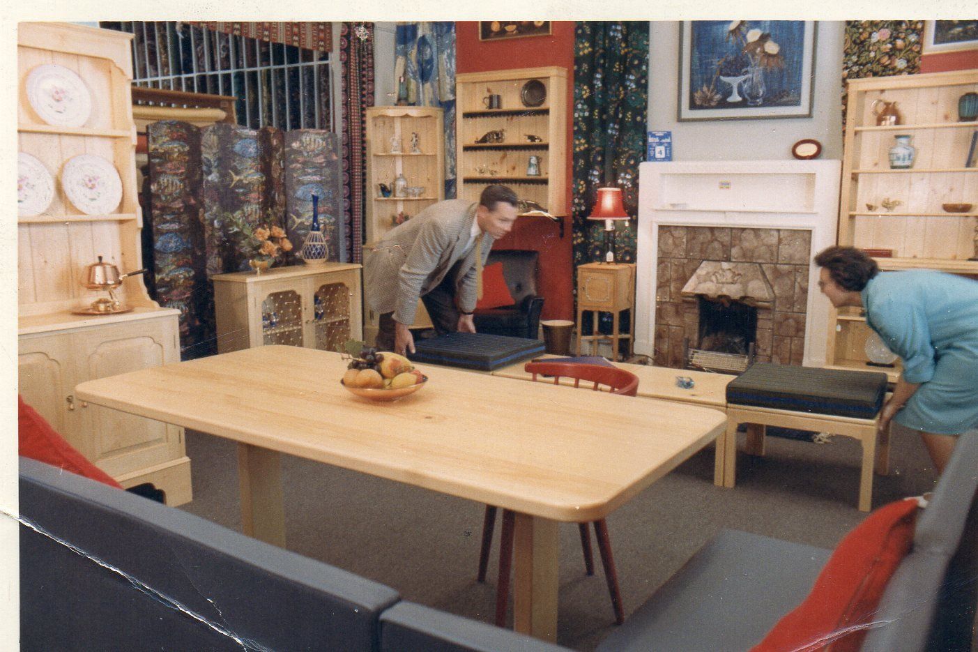 Staff rearranging furniture for Quaeck's furniture shop