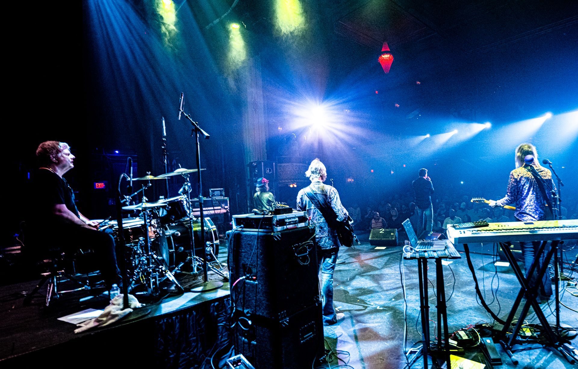 A group of people are playing instruments on a stage.