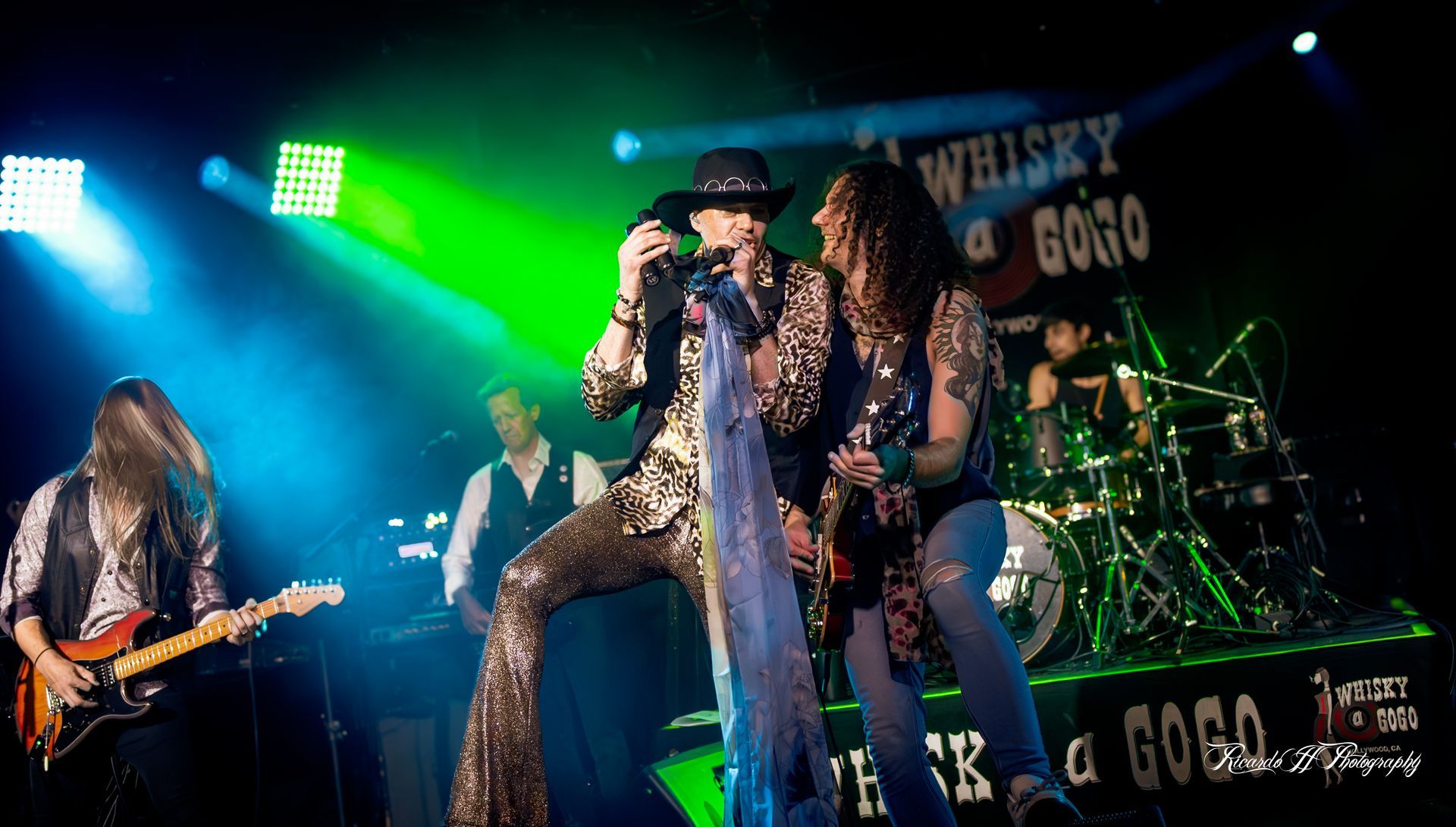 A group of people are playing instruments on a stage.