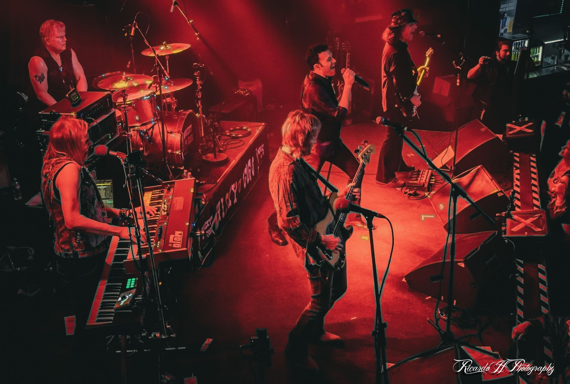 A group of people are playing instruments on a stage.