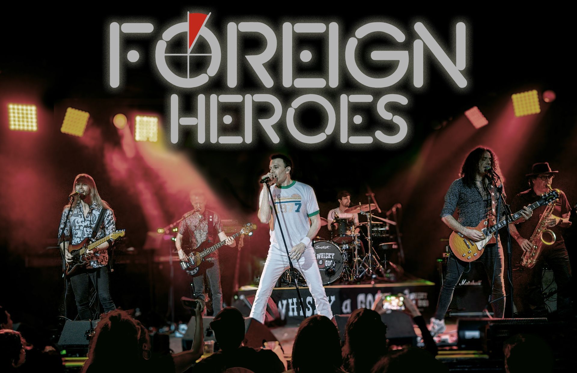 Foreign heroes are performing on stage in front of a crowd.