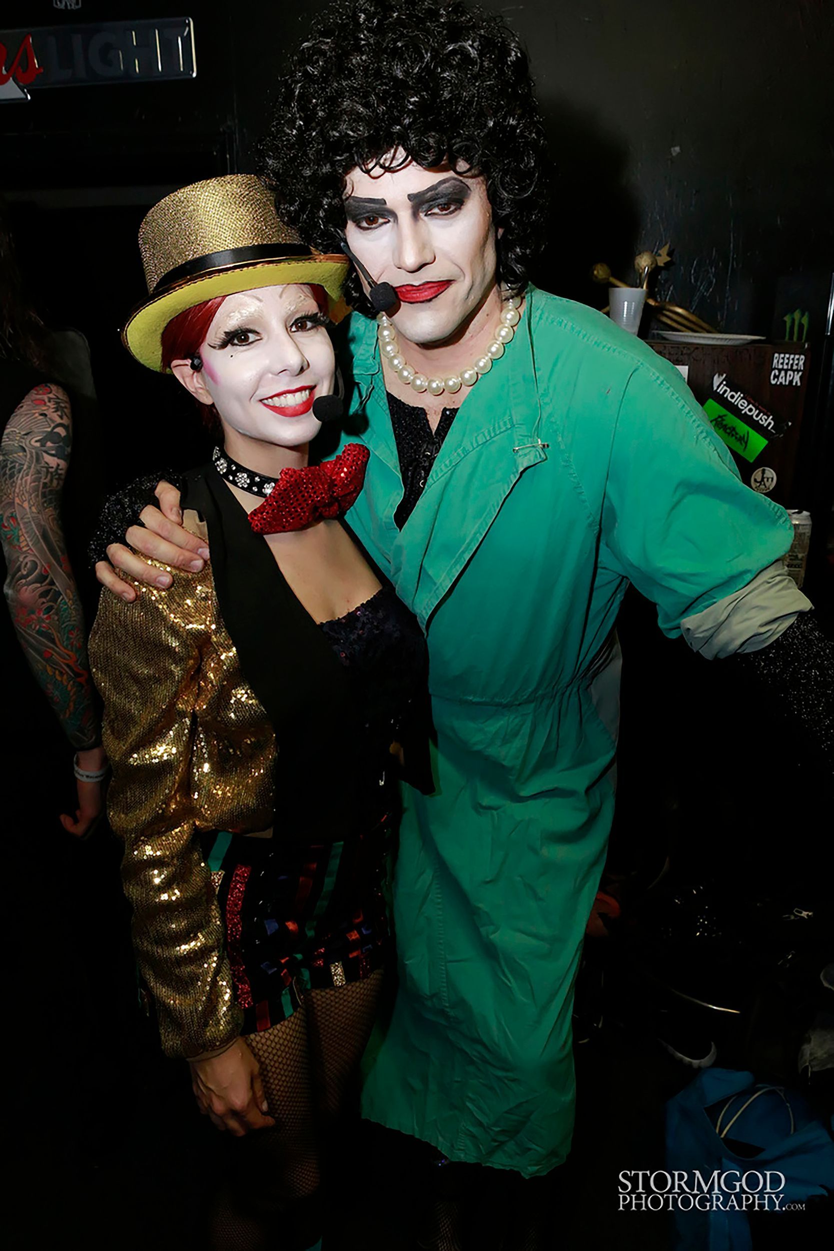 A man and a woman in costumes are posing for a picture.