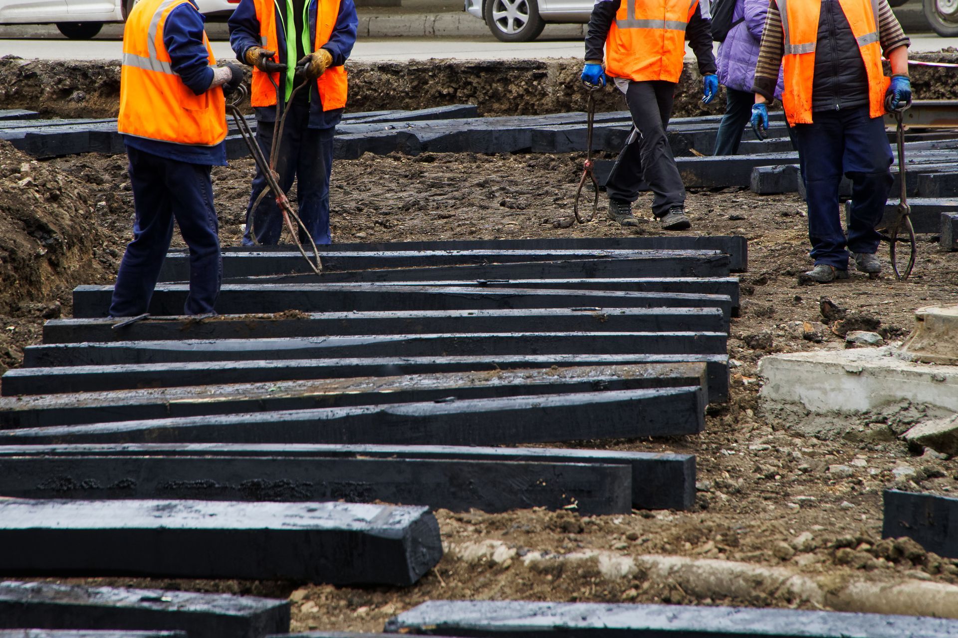 A group of construction workers are working on a construction site.