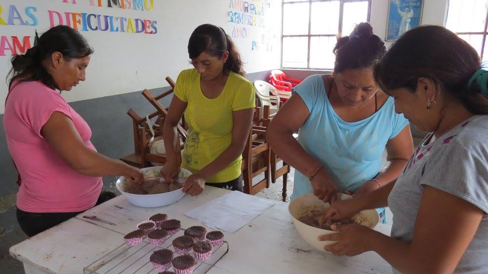 Women working together to create baked goods to support their livelihoods