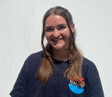 Picture of an Otra Cosa volunteer smiling in a portrait pose.