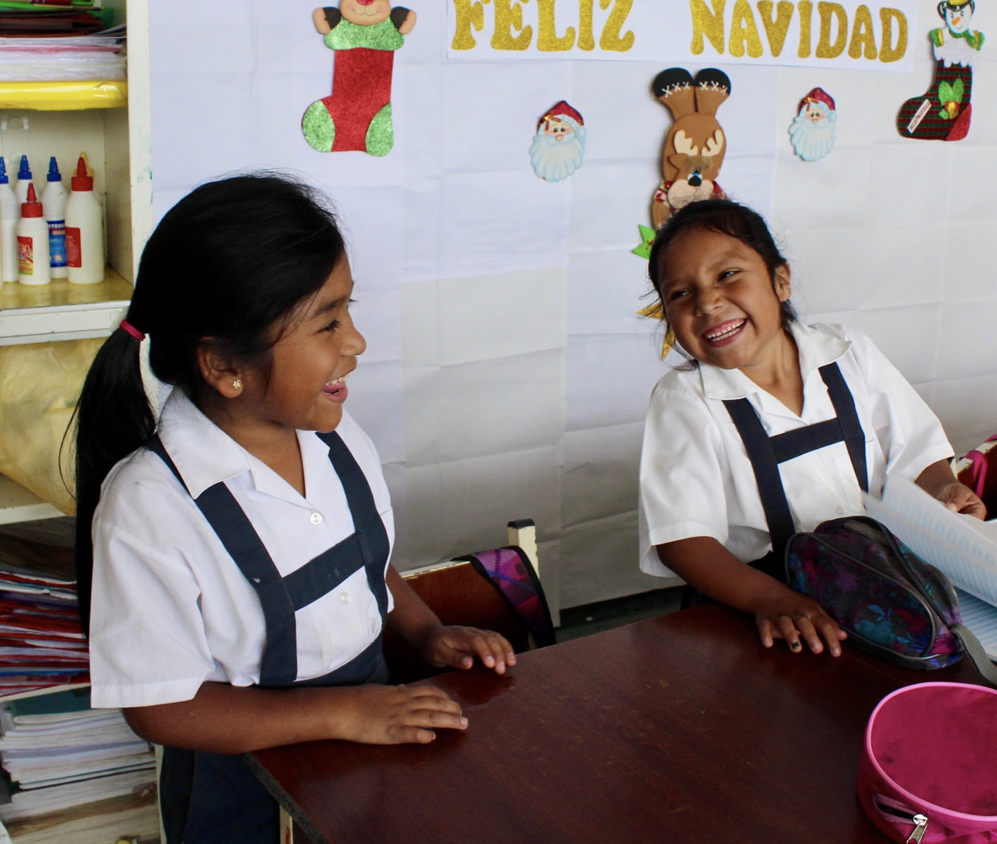 2 schoolchildren smiling together