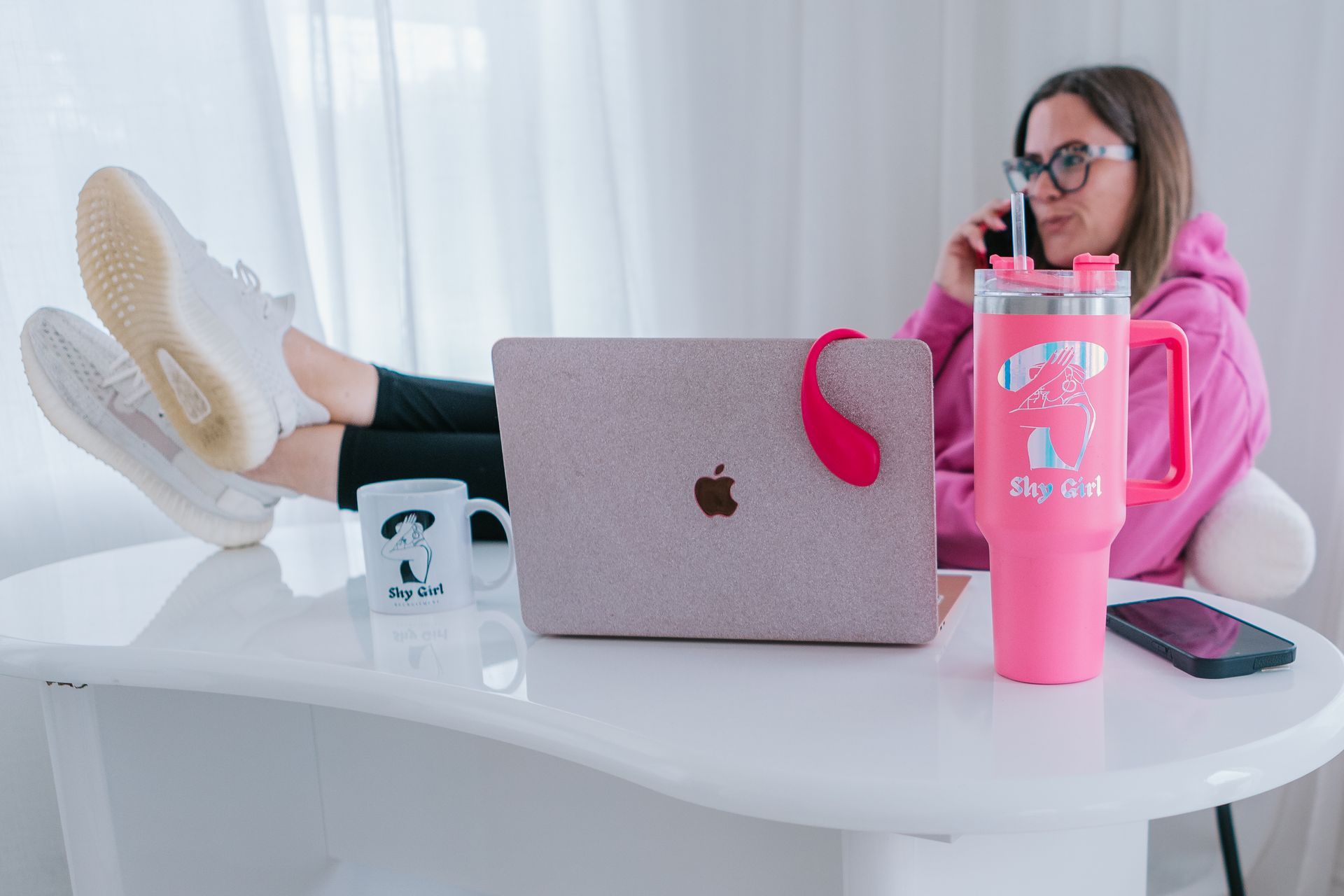 Woman learning webcam tips from online course with notebook and laptop