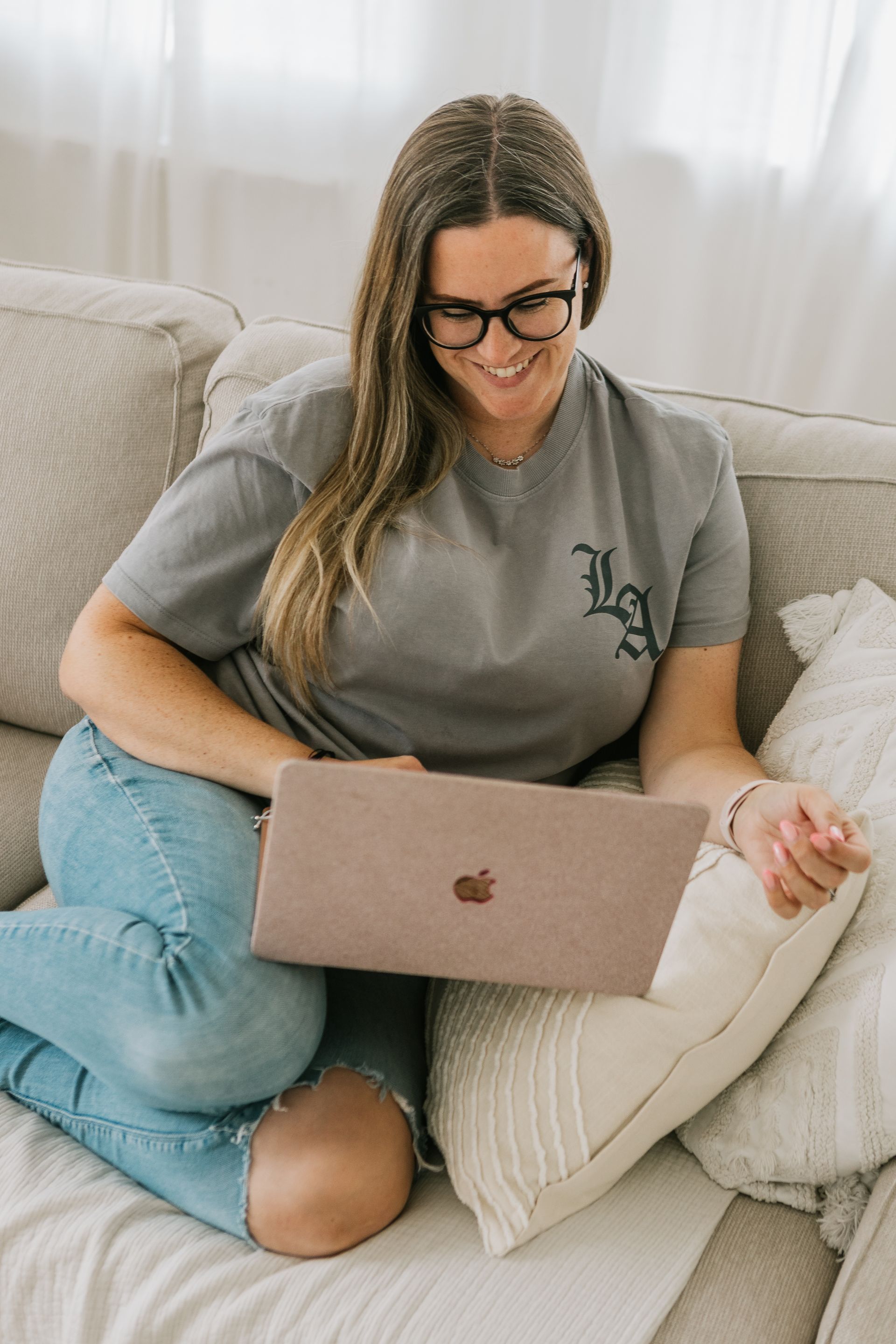 Woman learning webcam tips from online course with notebook and laptop