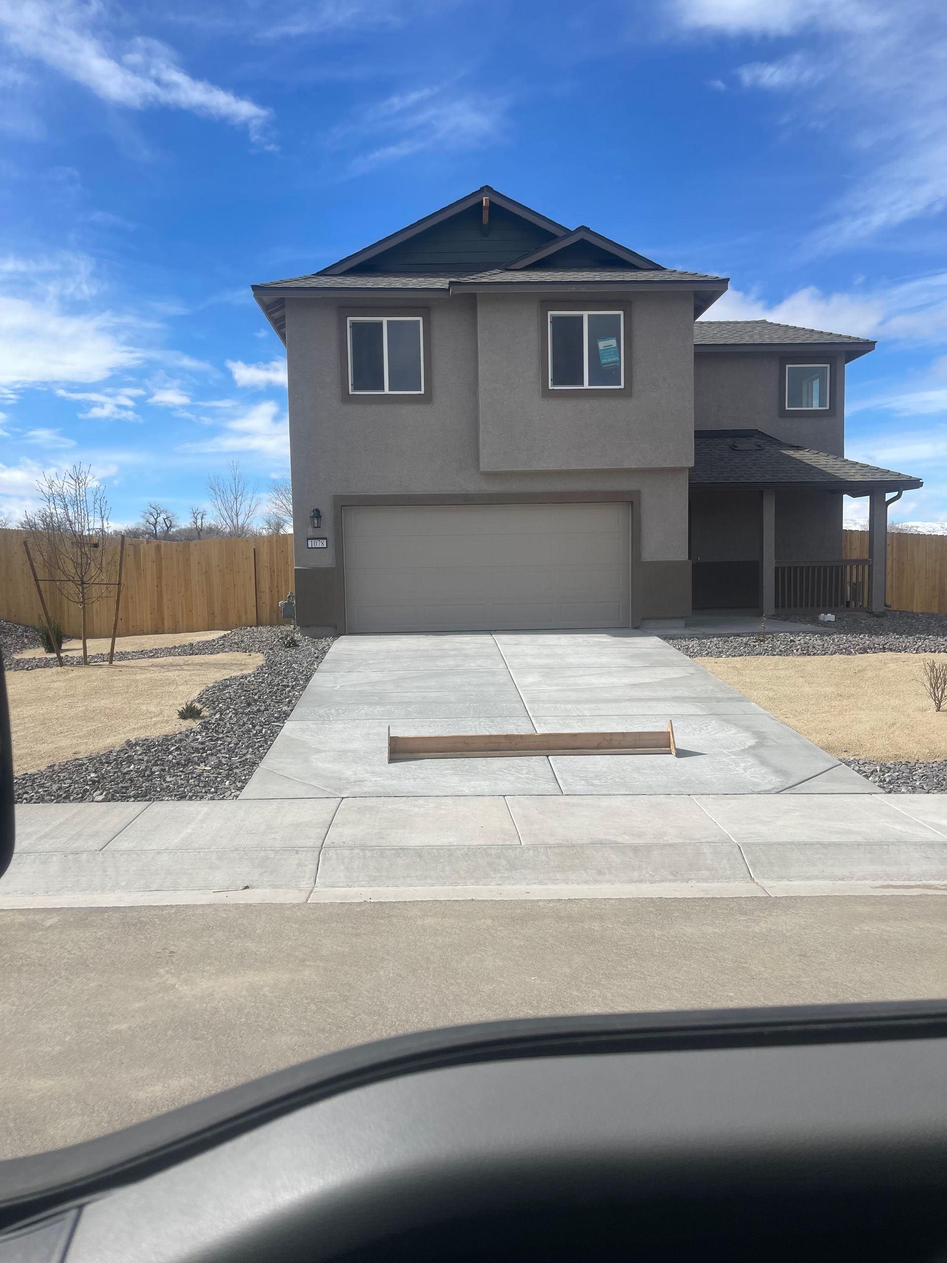 A new home with light brown Stucco siding in Reno, Nevada