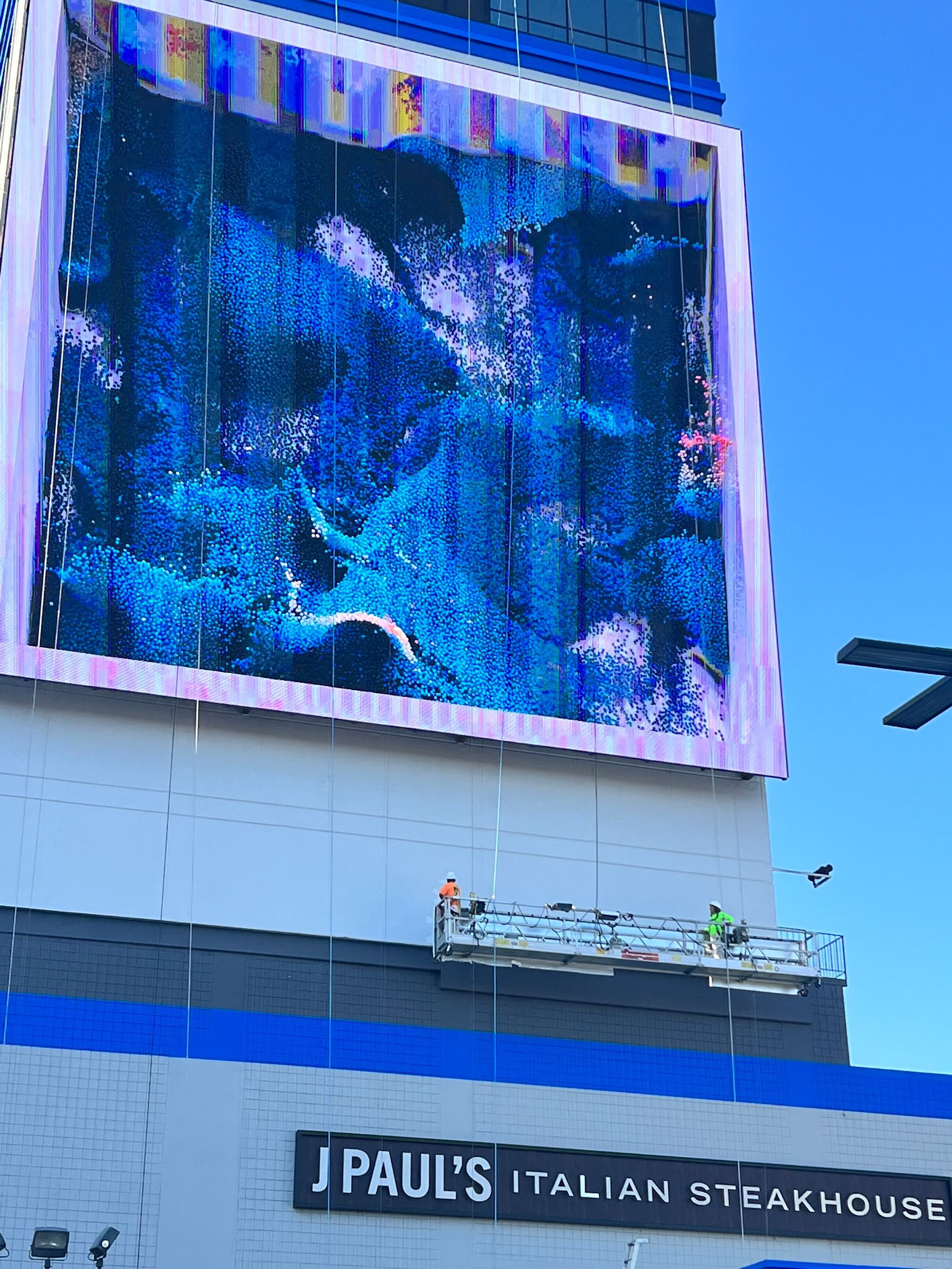 A large commercial building in Reno, NV getting stucco repaired and painted.