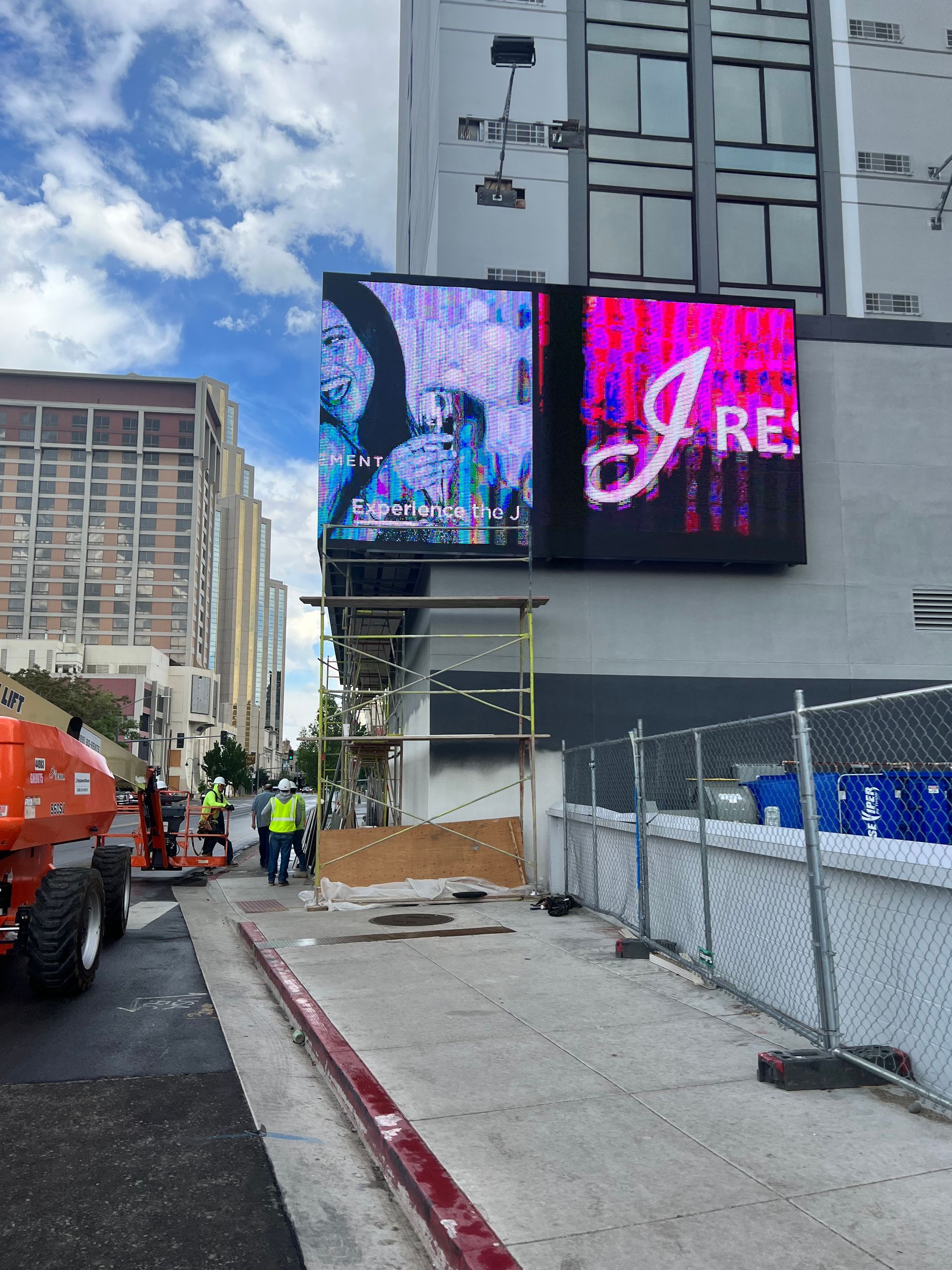 Construction workers in downtown Reno are preparing a building to get new stucco and paint installed.