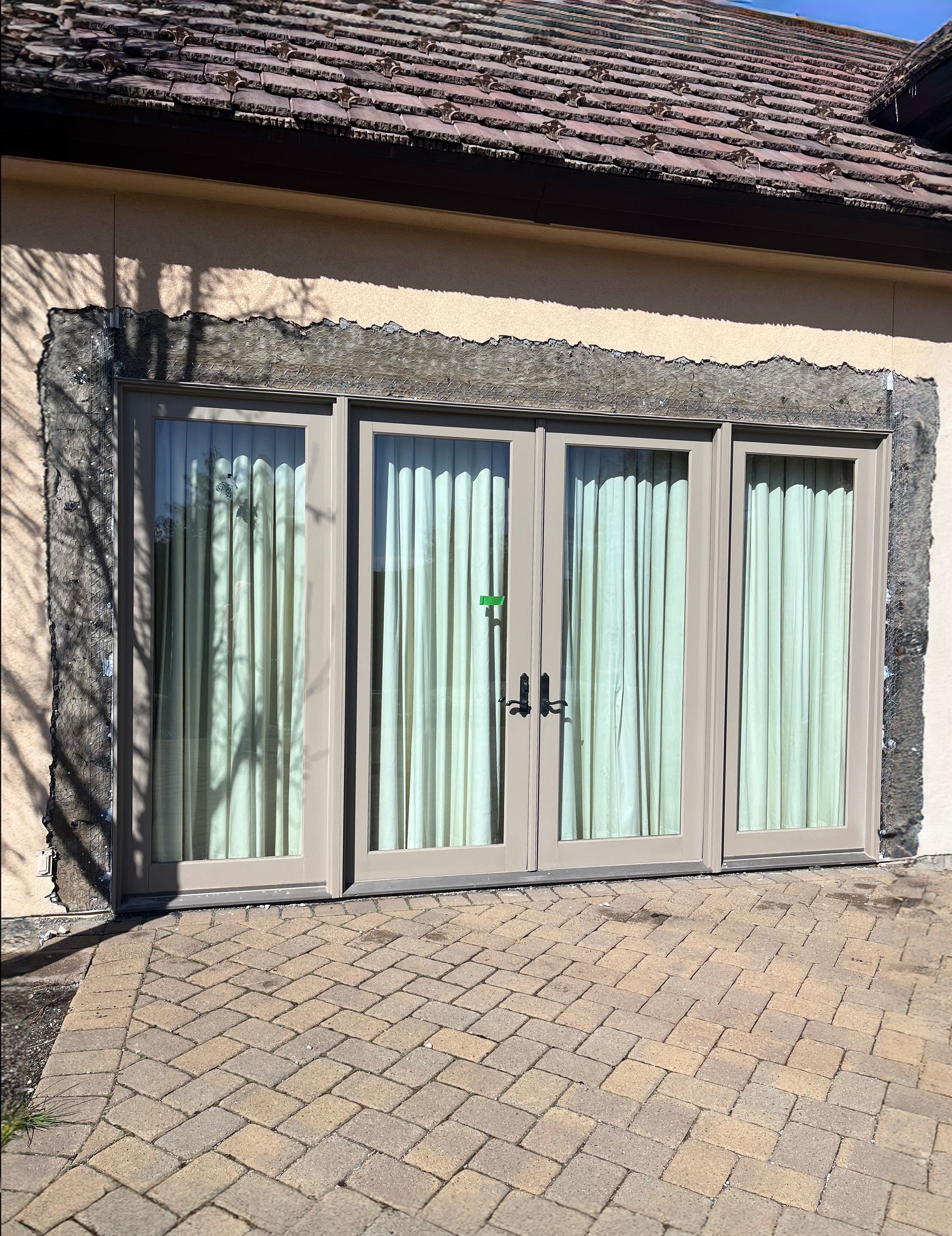 Stucco repair around new French doors in Reno, Nevada
