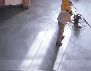man polishing the concrete flooring
