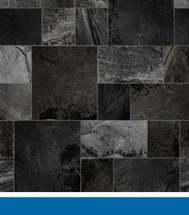 Black slate tile wall with various sized rectangular and square stones.