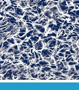 Water surface with white light reflections over a dark blue background.
