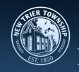 The seal of new trier township shows a house in a circle.