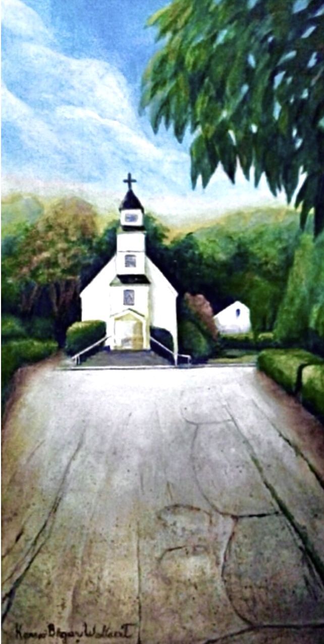 White church with black cross, gray road leading toward it, green trees surround.