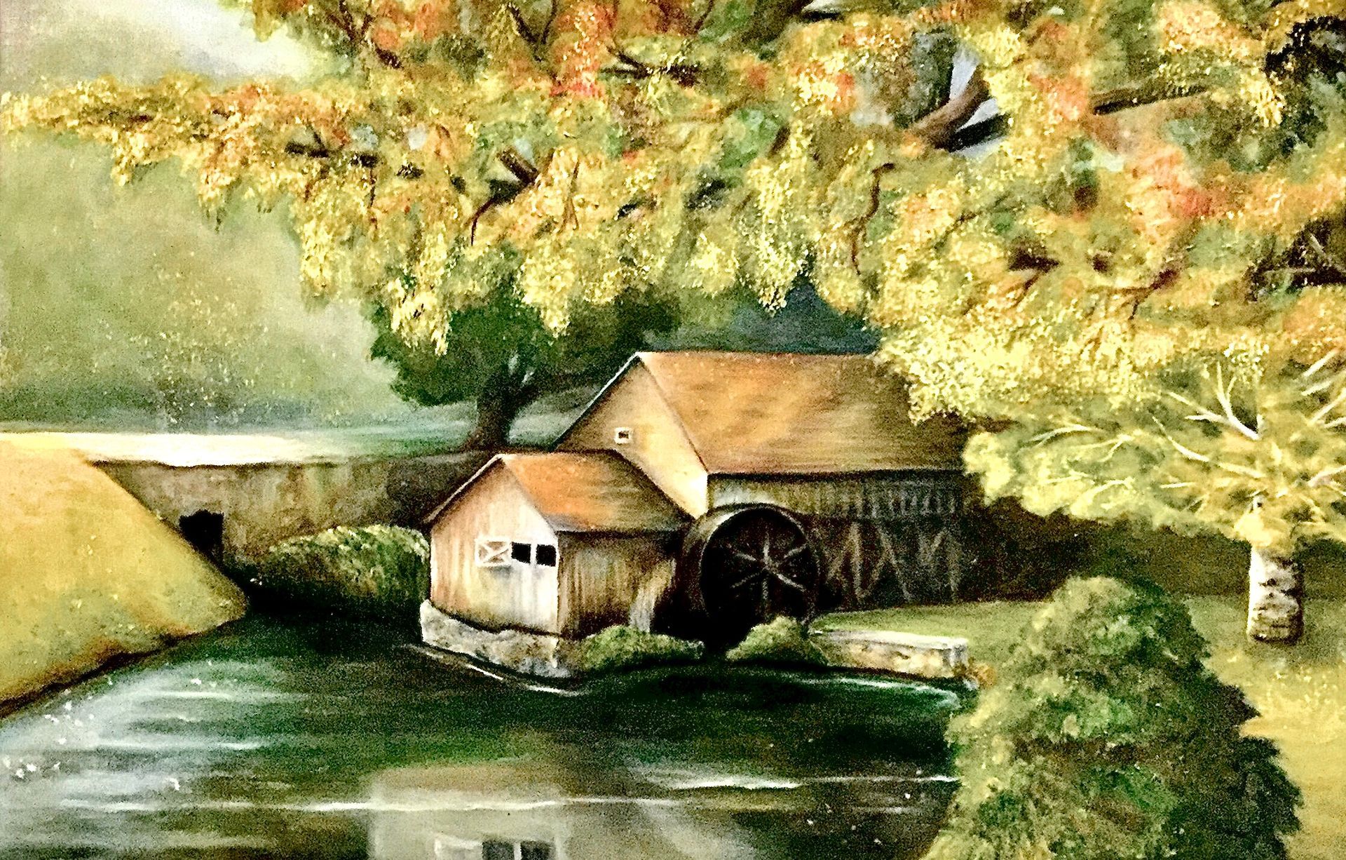 Watercolor painting of an old mill house with a water wheel, beside a reflective body of water, under a tree with fall foliage.