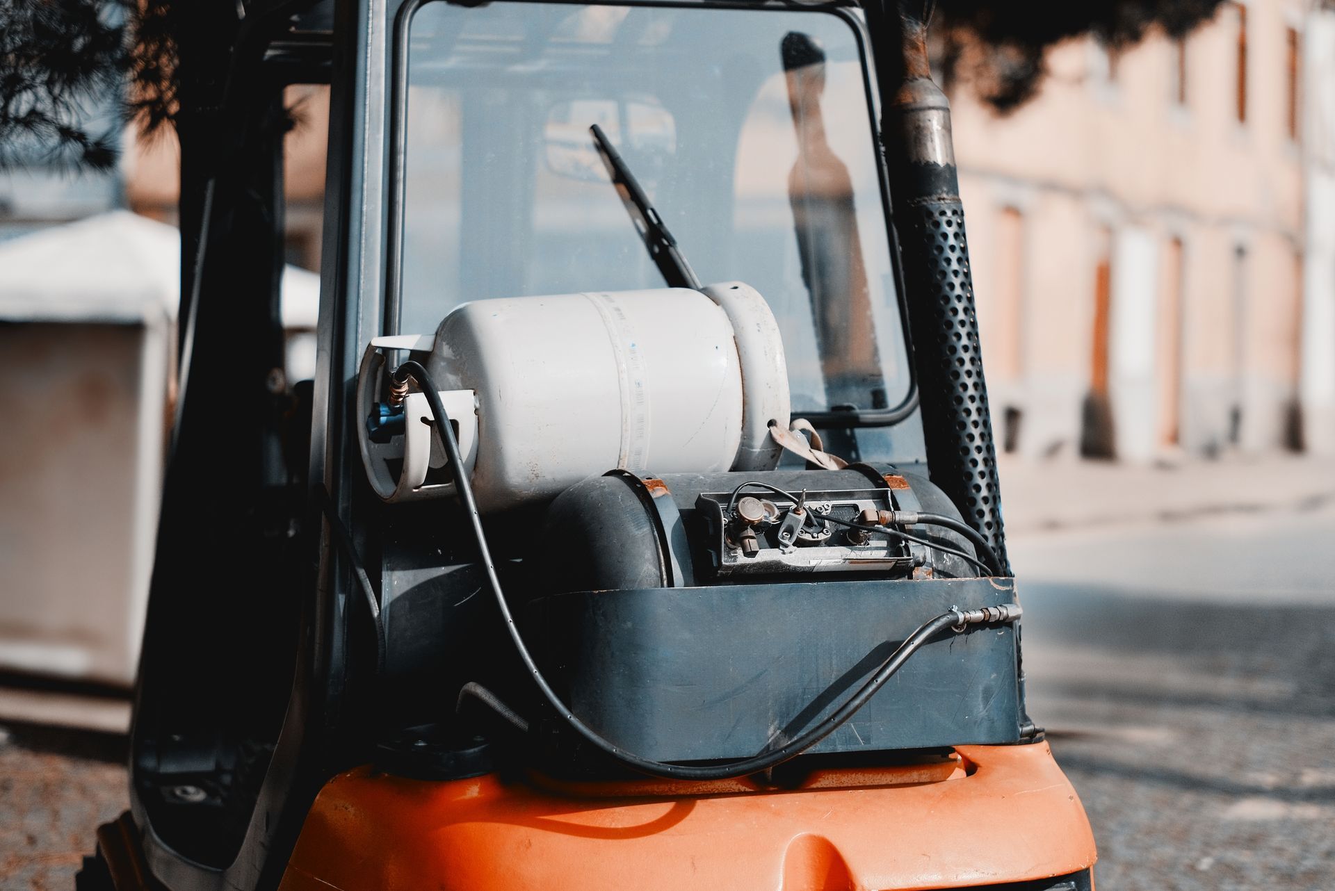 Close-up of a car engine, highlighting fuel injectors and electrical components. Dusty, metallic surfaces.