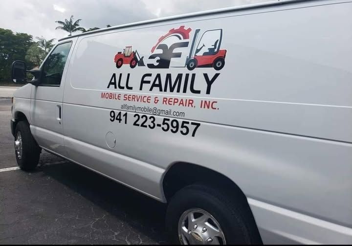 Stack of DEF fluid containers near a pressure washer. Sign reads