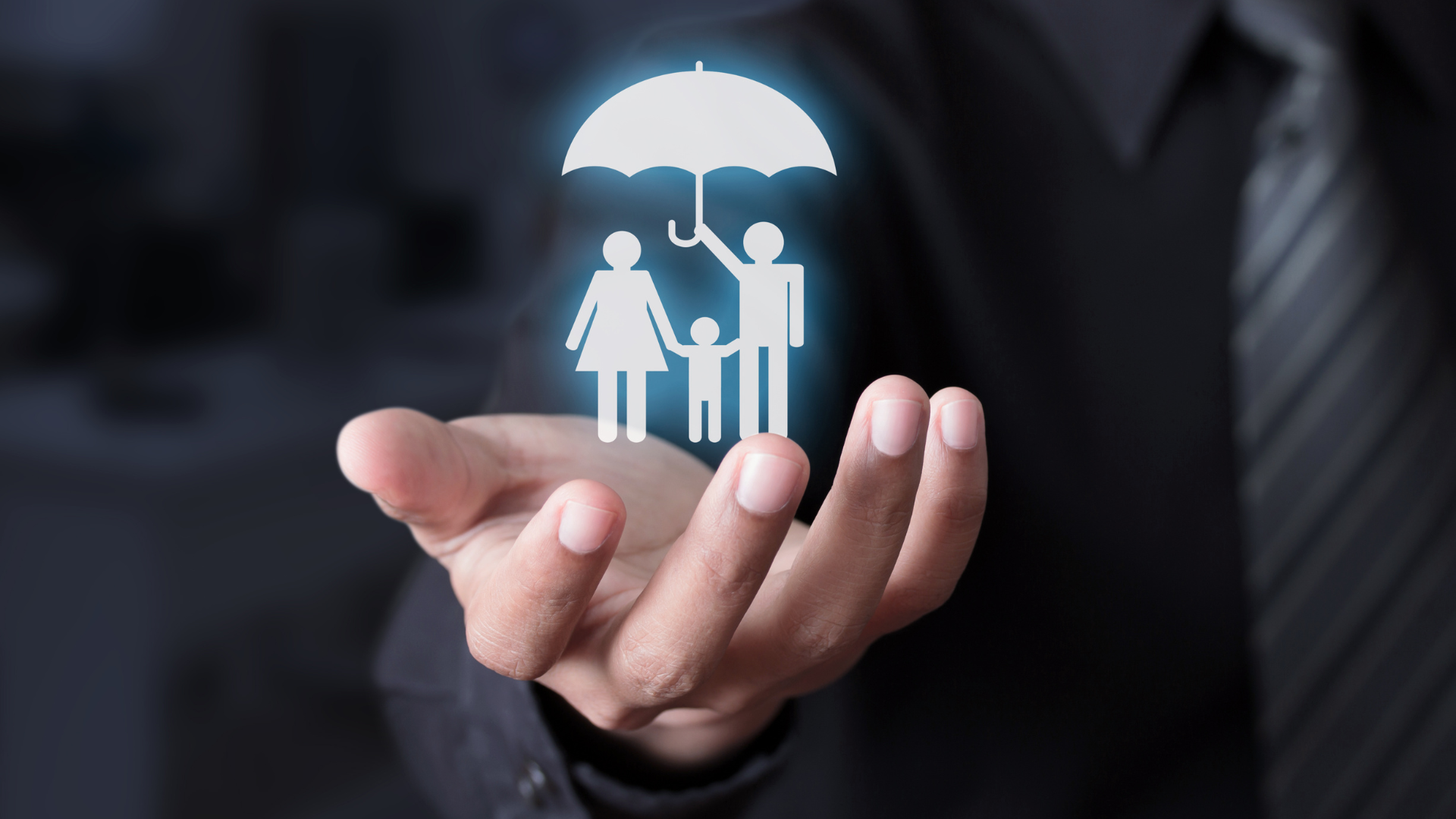 A person is holding a family under an umbrella