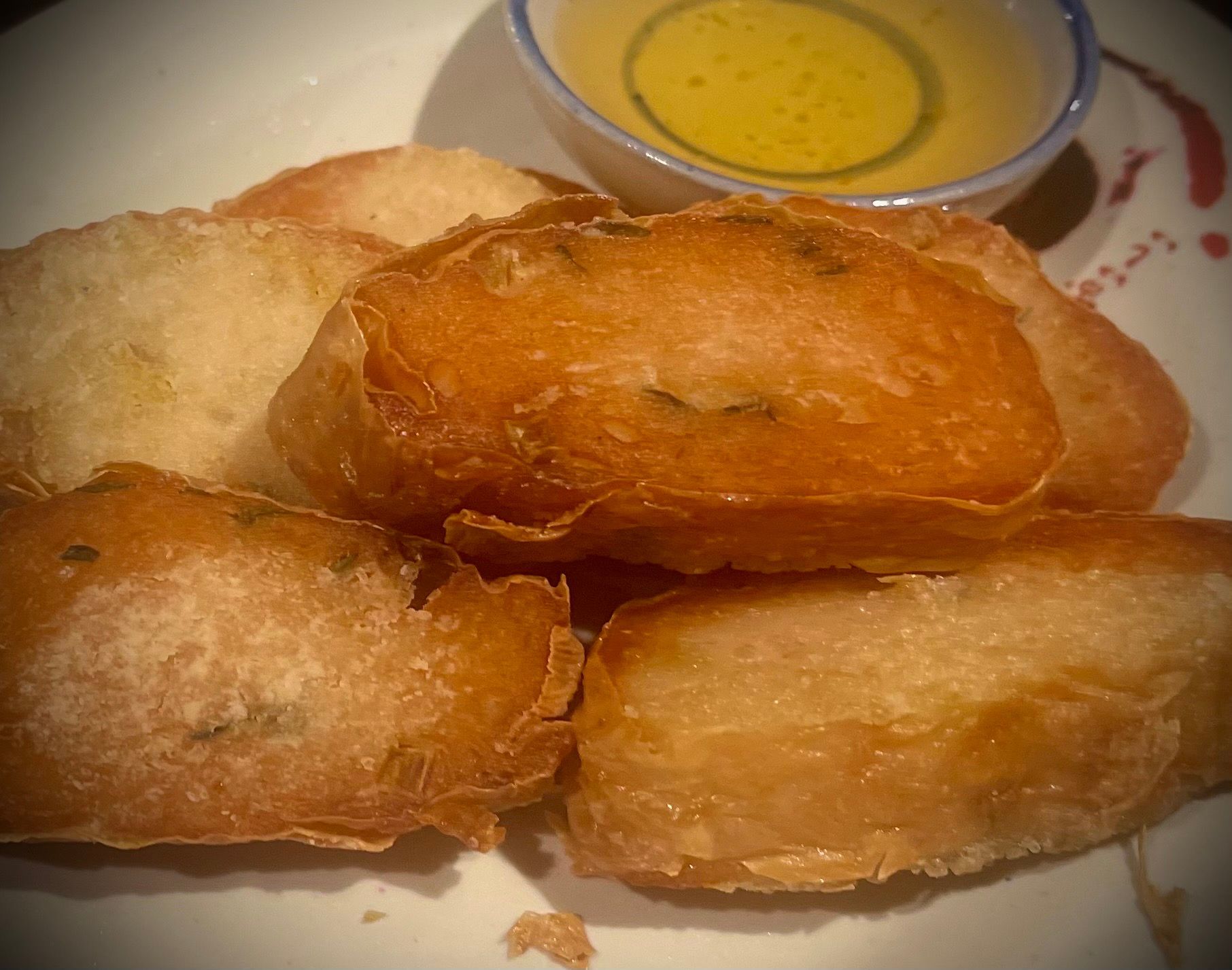 A plate of food with a small bowl of dipping sauce