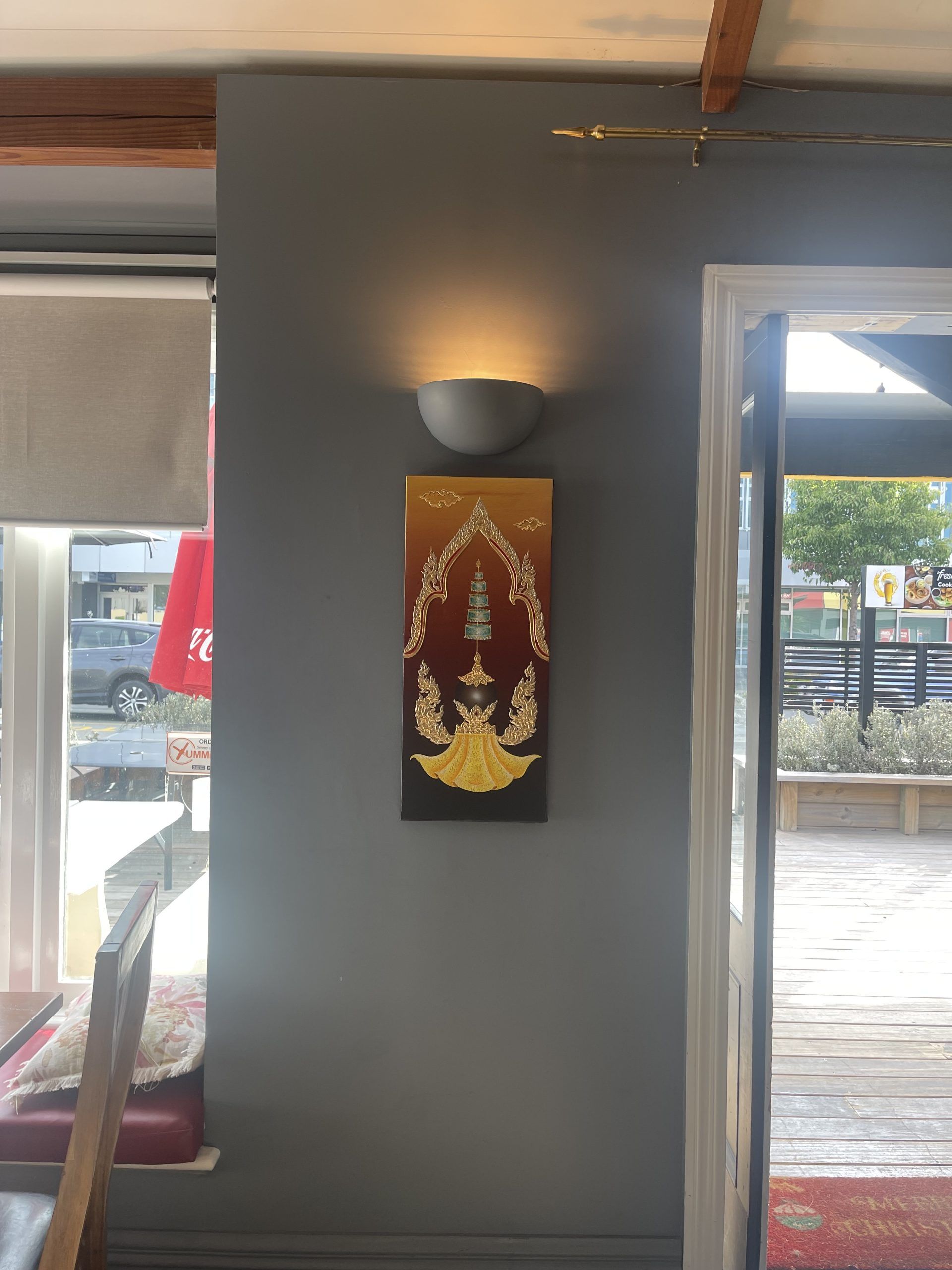 A painting is hanging on a wall in a room