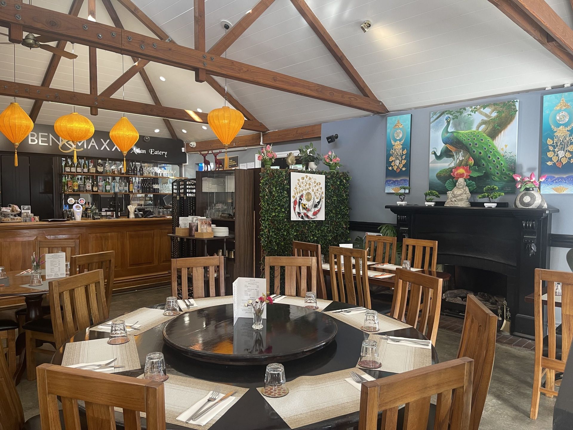 A restaurant with tables and chairs and a piano.