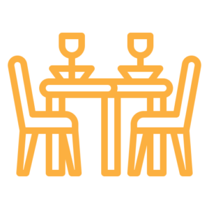 An icon of a table and chairs on a white background.