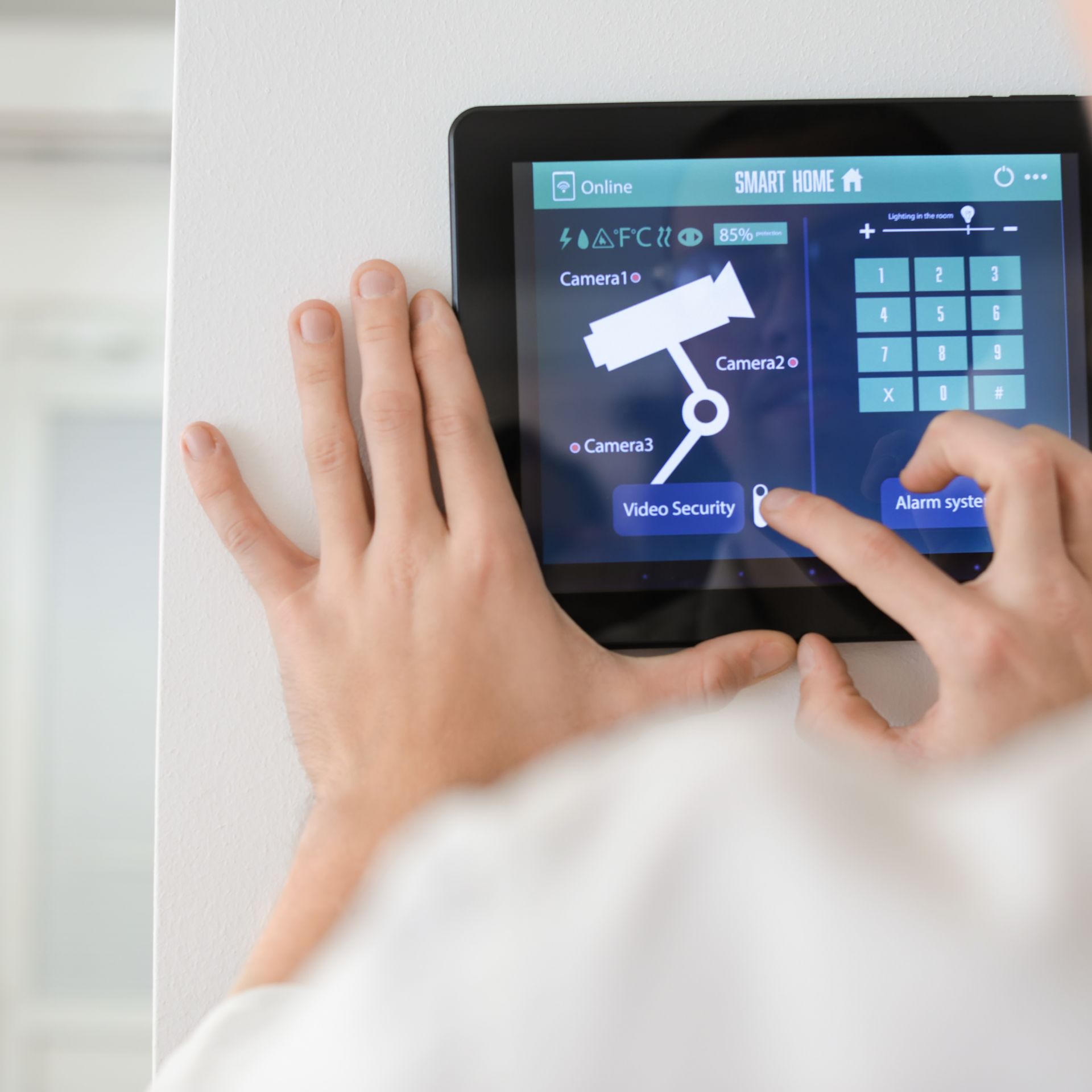 A person is using a smart home app on a tablet