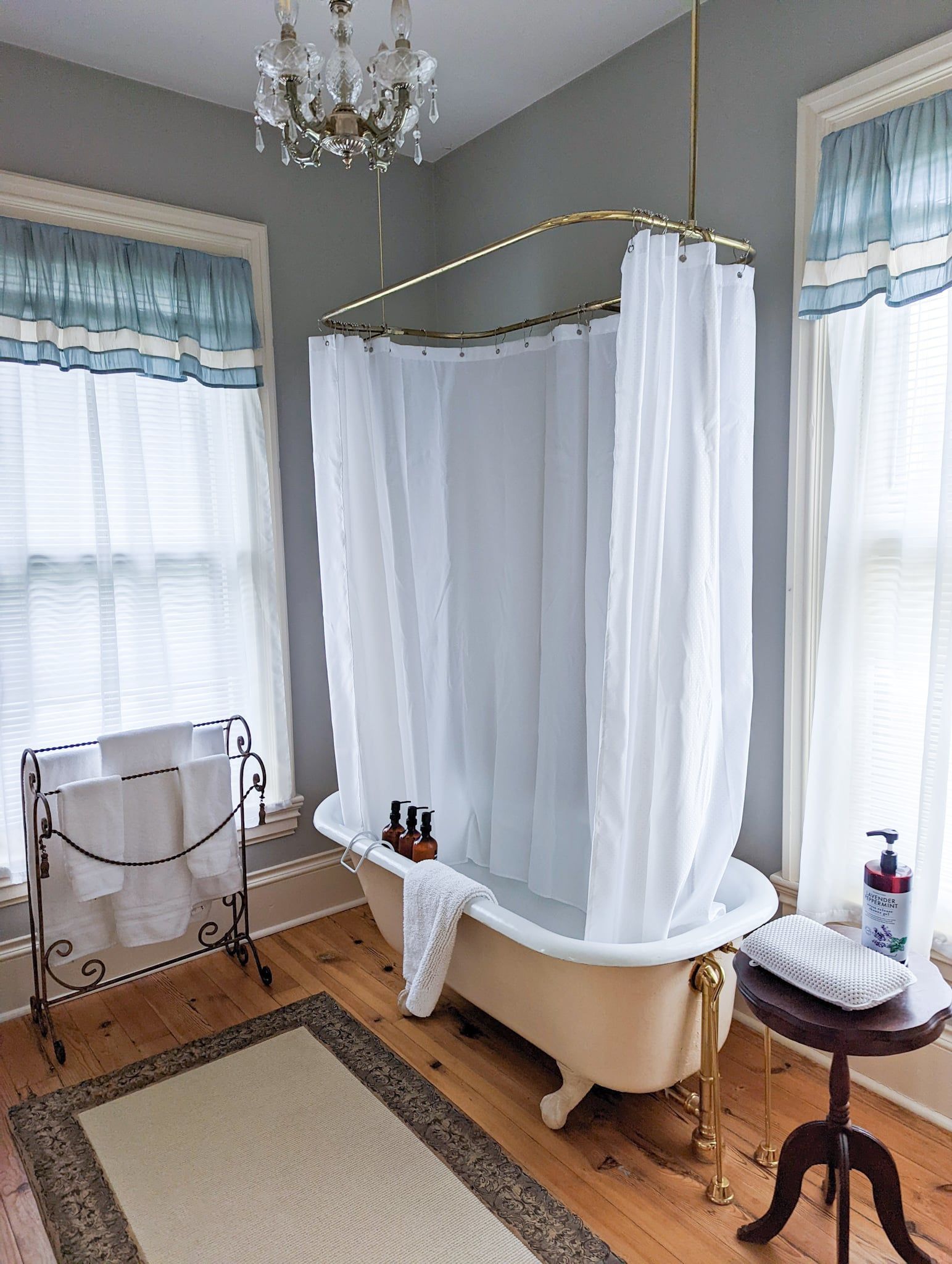 A bathroom with a bathtub and a shower curtain.