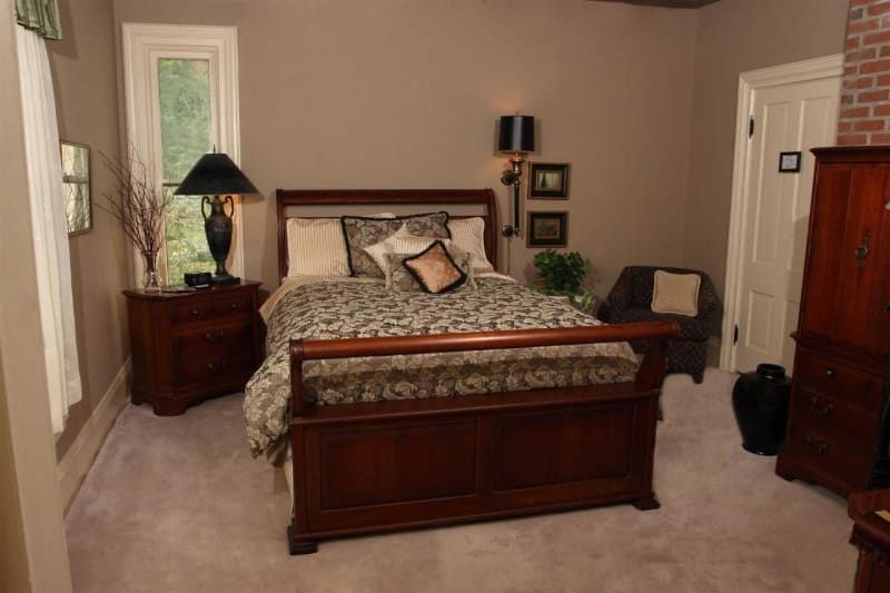 A bedroom with a king size bed and two nightstands