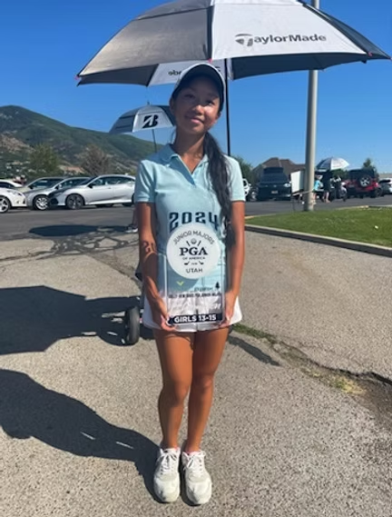 A woman wearing a shirt that says 2024 on it