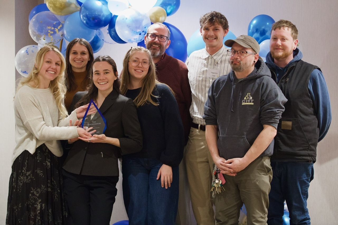 CHT staff assisting a client