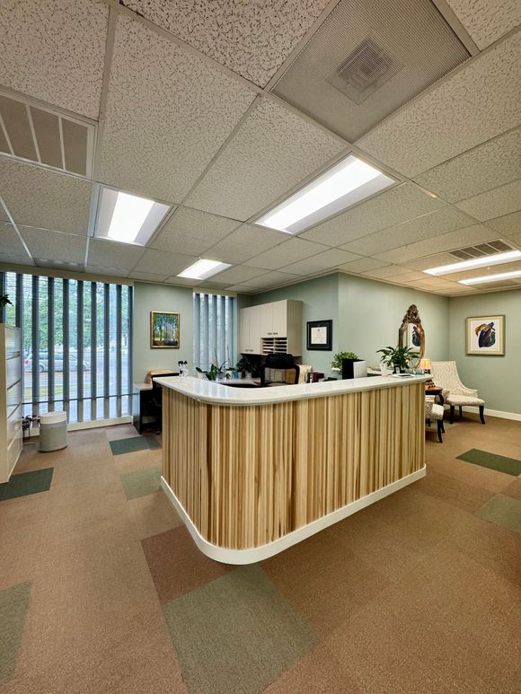A large room with a wooden counter in the middle