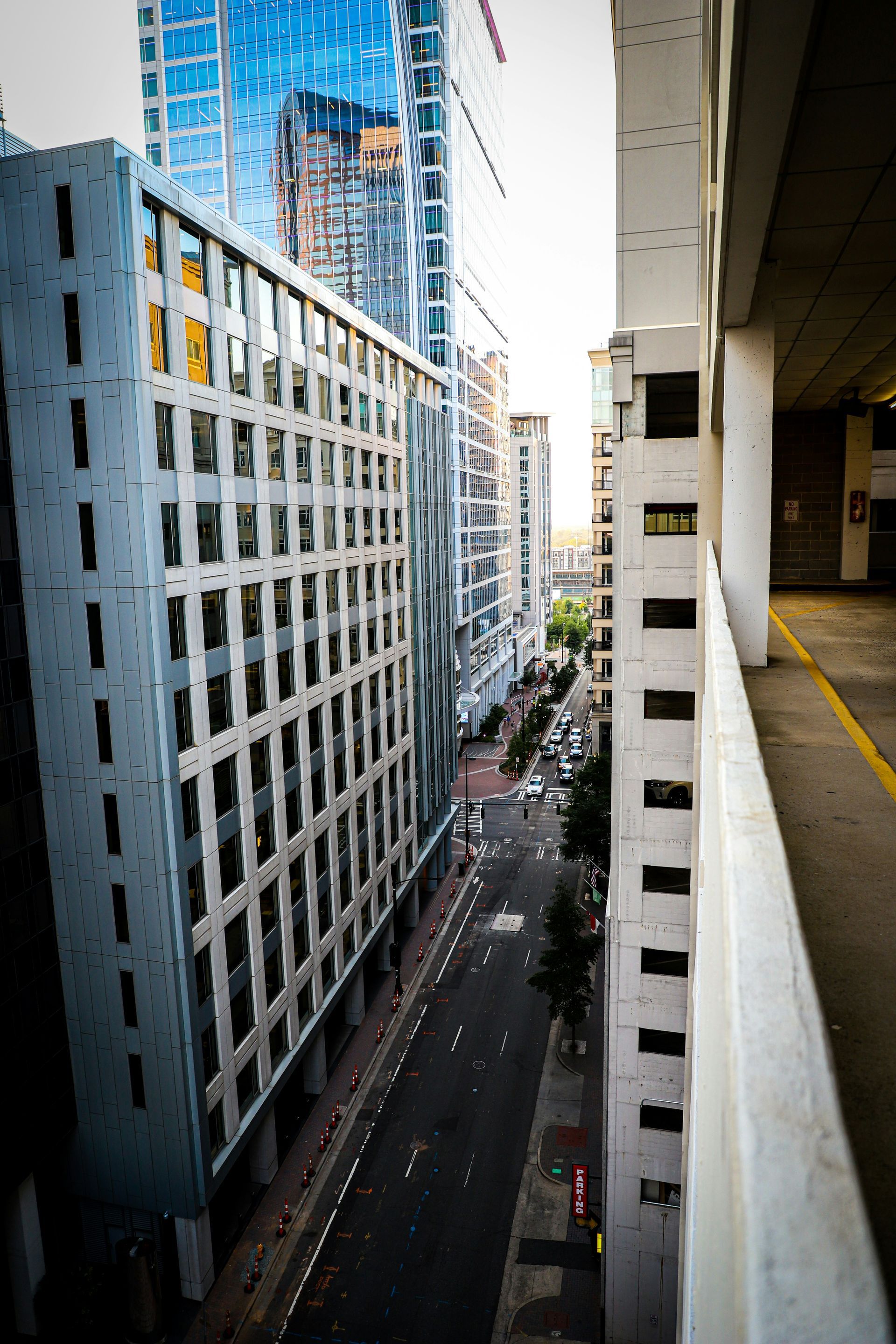 A view of a city street from a parking garage.