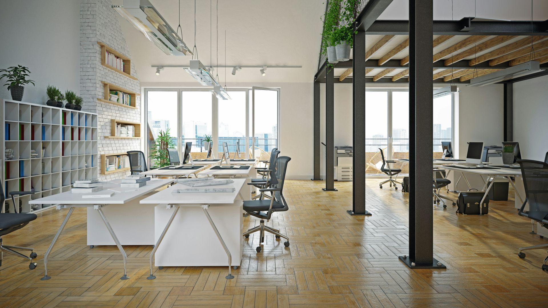 A modern office with lots of tables and chairs and a wooden floor.