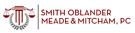 Smith Oblander Meade and Mitcham PC logo in red and grey color