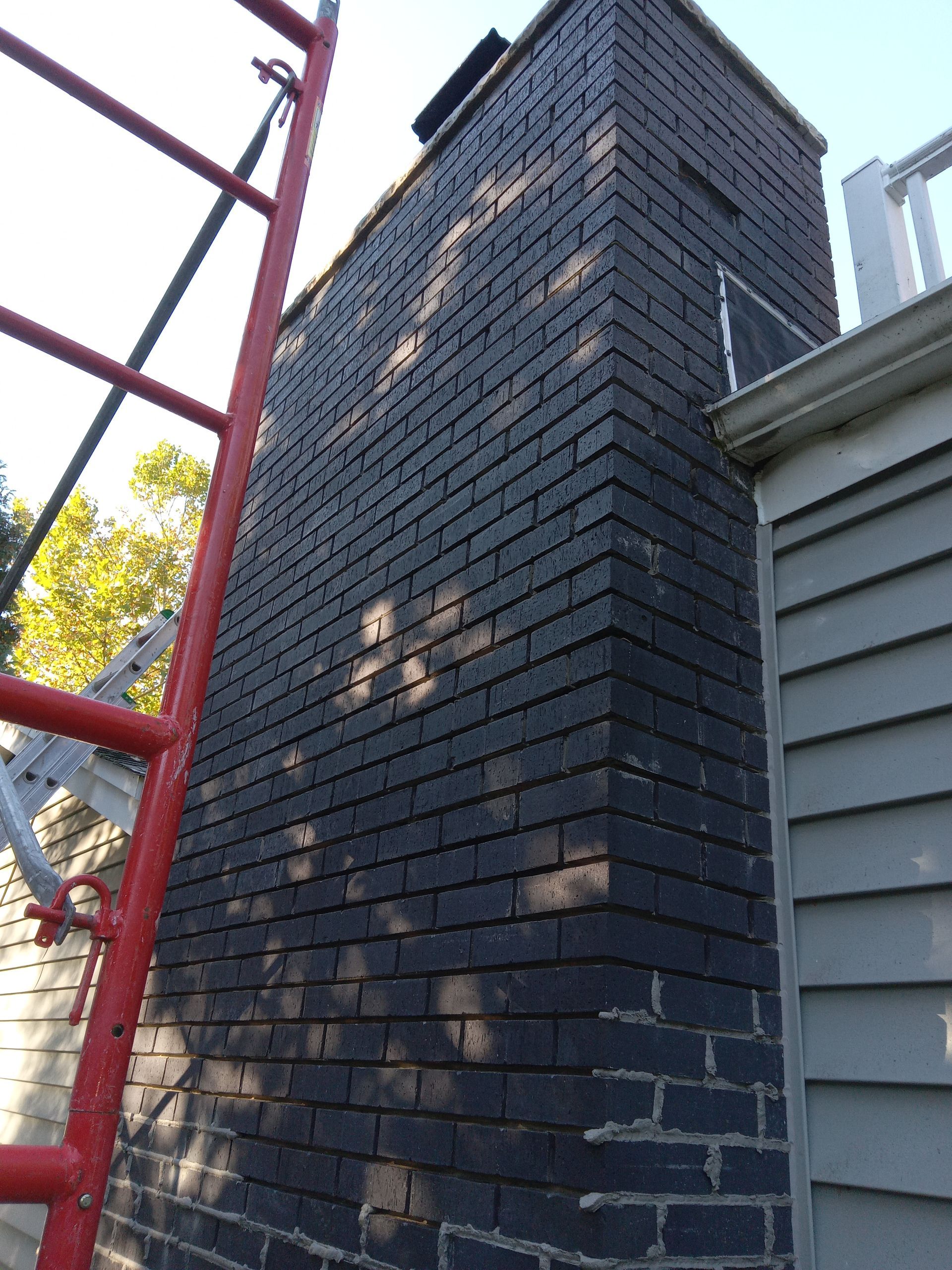 A collage of pictures shows a truck being repaired in a garage