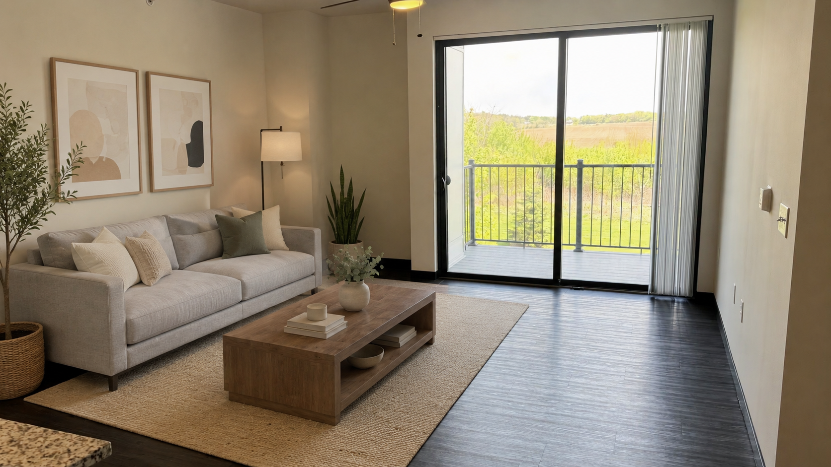 Bright living room with beige sofa, wooden coffee table, rug, and sliding glass doors to a balcony