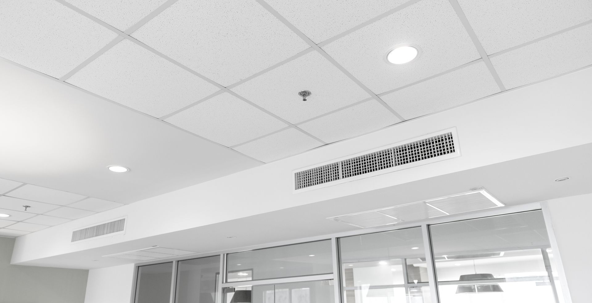 Completed ceiling-mounted air conditioner and can lights in Carrollwood office ceiling