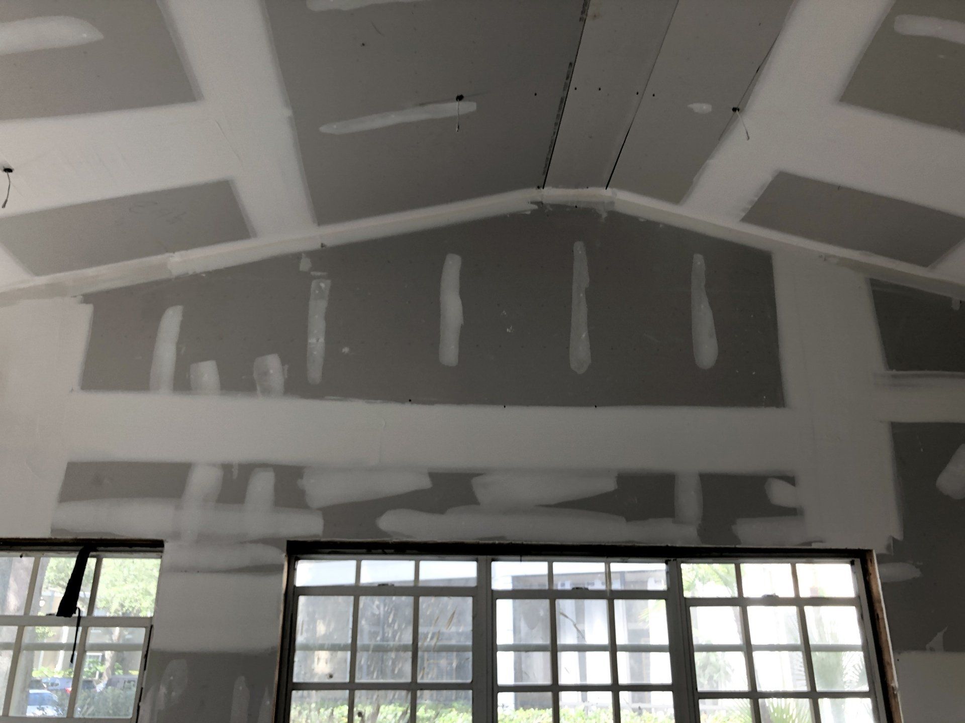 rough drywall install before wood is added for custom ceiling